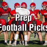 Stanwood's Michael Mascotti relays the next play to his teammates during football practice on Monday, Aug. 29, 2022 in Stanwood, Washington. (Olivia Vanni / The Herald)
