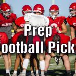 Stanwood's Michael Mascotti relays the next play to his teammates during football practice on Monday, Aug. 29, 2022 in Stanwood, Washington. (Olivia Vanni / The Herald)