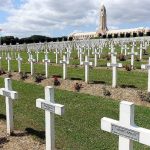 Red roses decorate gravestones in a military cemetery near Verdun, one of World War Is deadliest battlefields. (Rick Steves Europe)