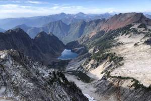 Copper Lake as seen from Vesper Peak on Oct. 8, 2023. A helicopter trying to land on the south end of the lake — the nearest shoreline in the image — crashed into the water in early September, where it remained weeks later. (Caleb Hutton / The Herald)