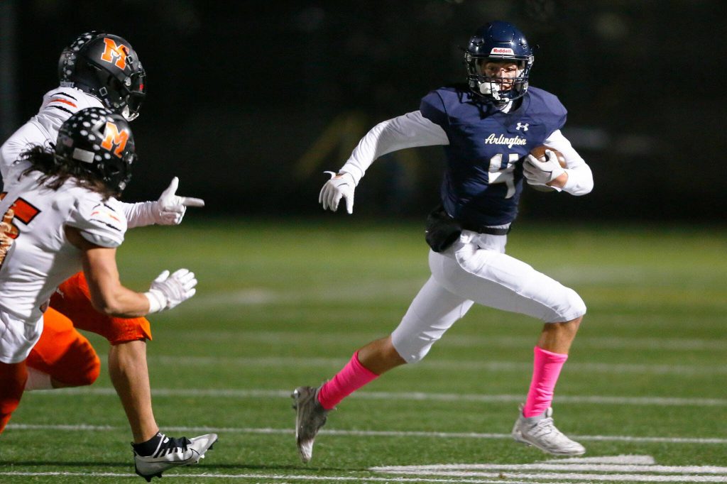 Arlington junior Jake Willis takes a kickoff for a solid return against Monroe on Friday, Oct. 27, 2023, at Arlington High School in Arlington, Washington. (Ryan Berry / The Herald)
