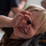 One of Stephanie Boyles sons plays with an olive as Boyle prepares dinner for her three children at their new apartment in Marysville, Washington, on Thursday, Sept. 14, 2023. (Annie Barker / The Herald)