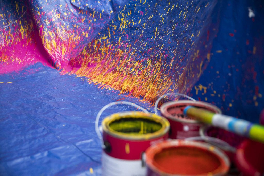 Paint splatter marks the outline of a canvas. (Olivia Vanni / The Herald)