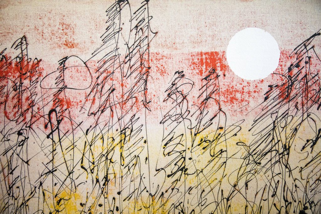 One of Sam Taylors paintings on display in his home. He used burlap and house paint to create this art piece. (Olivia Vanni / The Herald)