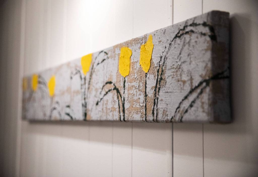 One of Sam Taylors paintings on display in the hallway of his home. (Olivia Vanni / The Herald)