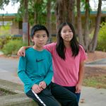 Siblings Qingyun Li, left, and Ruoyun Li, 12 and 13, respectively, are together on campus at Everett Community College. The two are taking three courses for credit at the community college and also a full load of middle school classes. (Ryan Berry / The Herald)