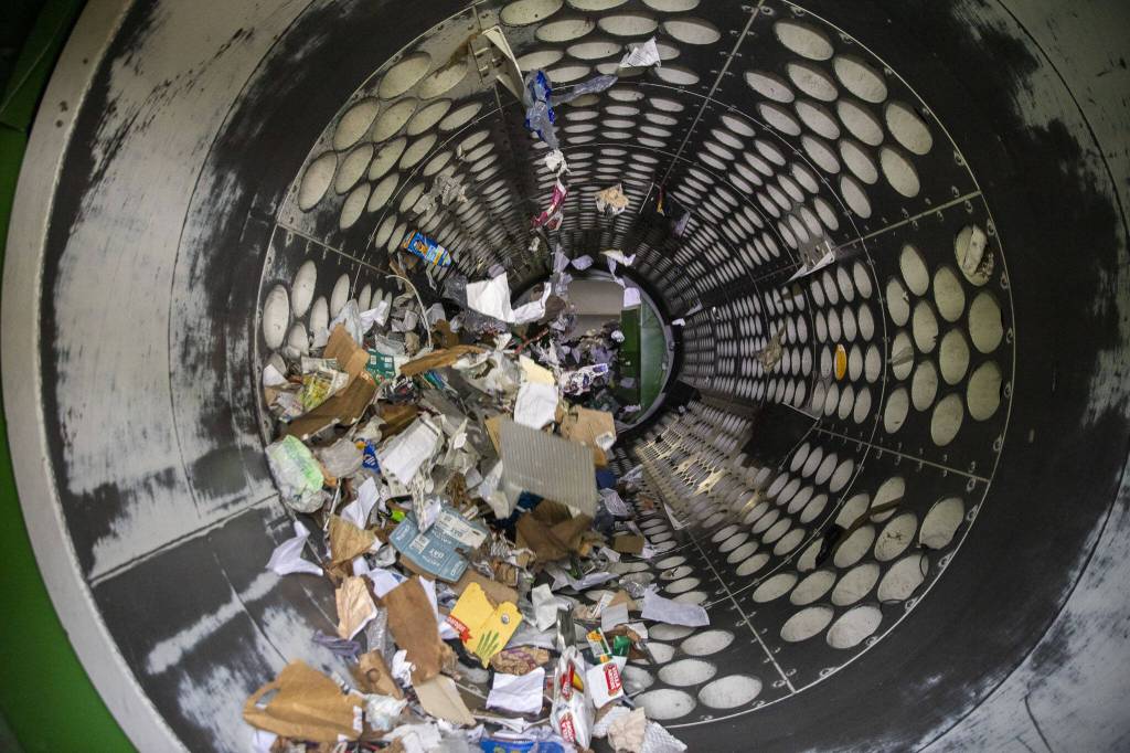 Items are sorted for recycling inside the Waste Management Cascade Recycling Center in Woodinville, Washington on Wednesday, Nov. 1, 2023. (Annie Barker / The Herald)