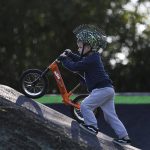 Rory Dunn, 4, pushes his bike on a new pump track at Jennings Nature Park in Marysville. (Annie Barker / The Herald)