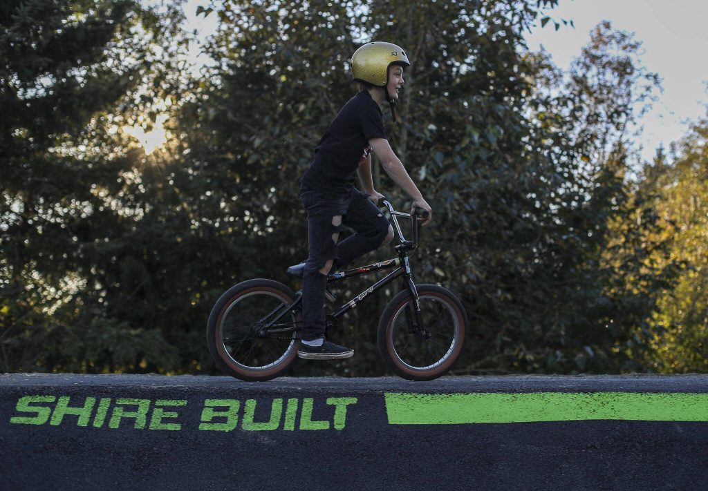 Abel Grant, 10, rides a new pump track for bikes at Jennings Nature Park in Marysville. (Annie Barker / The Herald)