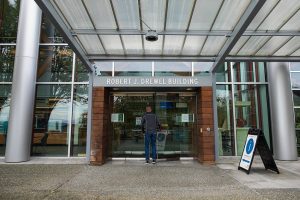 A person enters the Robert J. Drewel Building on Friday, Nov. 3, 2023, at the county campus in downtown Everett, Washington. (Ryan Berry / The Herald)