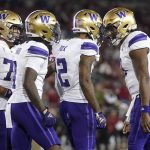 Washington wide receiver JaLynn Polk (2) is congratulated by quarterback Michael Penix Jr., right, after scoring against Stanford during a game Oct. 28 in Stanford, Calif. (AP Photo/Jeff Chiu)