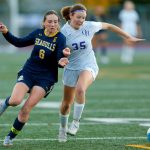Everetts Avery Marsall tries to fend off a defender during a district playoff matchup against Oak Harbor on Thursday, Nov. 2, 2023, at Shoreline Stadium in Shoreline, Washington. (Ryan Berry / The Herald)