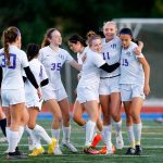 Oak Harbor celebrates a goal by forward Addisen Boyer (11) during a district playoff matchup against Everett on Thursday, Nov. 2, 2023, at Shoreline Stadium in Shoreline, Washington. It would be the only game of the match for either team. (Ryan Berry / The Herald)