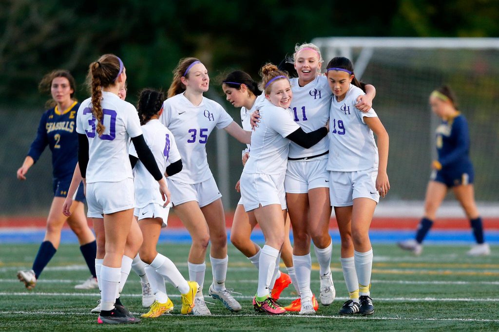 Oak Harbor celebrates a goal by forward Addisen Boyer (11) during a district playoff matchup against Everett on Thursday, Nov. 2, 2023, at Shoreline Stadium in Shoreline, Washington. It would be the only game of the match for either team. (Ryan Berry / The Herald)
