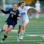 Everett’s Avery Marsall tries to fend off a defender during a district playoff matchup against Oak Harbor on Thursday, Nov. 2, 2023, at Shoreline Stadium in Shoreline, Washington. (Ryan Berry / The Herald)