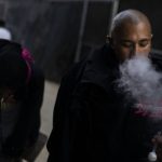 Armando Rivera, 33, smokes fentanyl mixed with methamphetamine in an alley in Los Angeles, Thursday, Aug.18, 2022. Use of fentanyl, a powerful synthetic opioid that is cheap to produce and is often sold as is or laced in other drugs, has exploded. Because it's 50 times more potent than heroin, even a small dose can be fatal. It has quickly become the deadliest drug in the nation, according to the Drug Enforcement Administration. (AP Photo/Jae C. Hong)