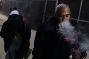 Armando Rivera, 33, smokes fentanyl mixed with methamphetamine in an alley in Los Angeles, Thursday, Aug.18, 2022. Use of fentanyl, a powerful synthetic opioid that is cheap to produce and is often sold as is or laced in other drugs, has exploded. Because it's 50 times more potent than heroin, even a small dose can be fatal. It has quickly become the deadliest drug in the nation, according to the Drug Enforcement Administration. (AP Photo/Jae C. Hong)