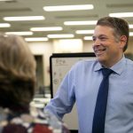 Garth Fell, incumbent Snohomish County Auditor, cracks a smile as the first results of the 2023 election appear on a screen at the elections office in Administrative Building West on Tuesday, Nov. 7, 2023, in downtown Everett, Washington. Fell led by nearly 20% after initial results. (Ryan Berry / The Herald)