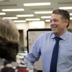 Garth Fell, incumbent Snohomish County Auditor, cracks a smile as the first results of the 2023 election appear on a screen at the elections office in Administrative Building West on Tuesday, Nov. 7, 2023, in downtown Everett, Washington. Fell led by nearly 20% after initial results. (Ryan Berry / The Herald)