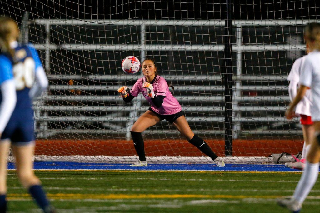 Mountlake Terrace freshman goaltender Jordyn Stokes grabs a shot during a district playoff matchup against Ferndale on Thursday, Nov. 2, 2023, at Shoreline Stadium in Shoreline, Washington. (Ryan Berry / The Herald)