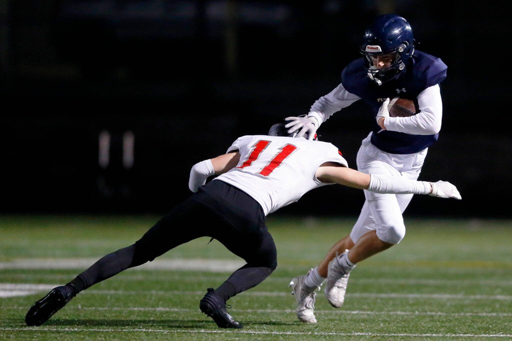 Arlingtons Jake Willis gets by a defender against Ballard during a playoff matchup Friday, Nov. 3, 2023, at Arlington High School in Arlington, Washington. (Ryan Berry / The Herald)