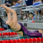 Kamiak junior Julia Lorenzo pushes off from the wall to begin the 100 yard backstroke during the Wesco 4A District 1 Girls Swim and Dive Finals on Saturday, Nov. 4, 2023, at the Snohomish Aquatic Center in Snohomish, Washington. (Ryan Berry / The Herald)