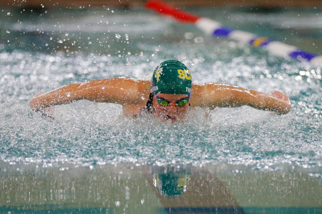 Shorecrest senior Miranda Thompson swims her way to a state berth in the 100 yard butterfly during the Wesco 3A Division 1 Girls Swim and Dive Finals on Saturday, Nov. 4, 2023, at the Snohomish Aquatic Center in Snohomish, Washington. (Ryan Berry / The Herald)