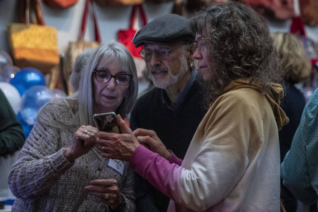 People look at election results for Snohomish County at 230 Ave B. in Snohomish, Washington on Tuesday, Nov. 7, 2023. (Annie Barker / The Herald)