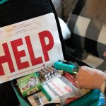 Gail Thompson opens up a backpack of emergency supplies that she keeps at her home Thursday, Feb. 2, 2023, in Oso, Washington. (Ryan Berry / The Herald)