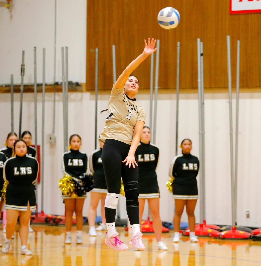 Lynnwood senior Paige Gessey serves the ball during a Wesco 3A District volleyball matchup against Shorecrest on Thursday, Nov. 9, 2023, at Marysville Pilchuck High School in Marysville, Washington. (Ryan Berry / The Herald)