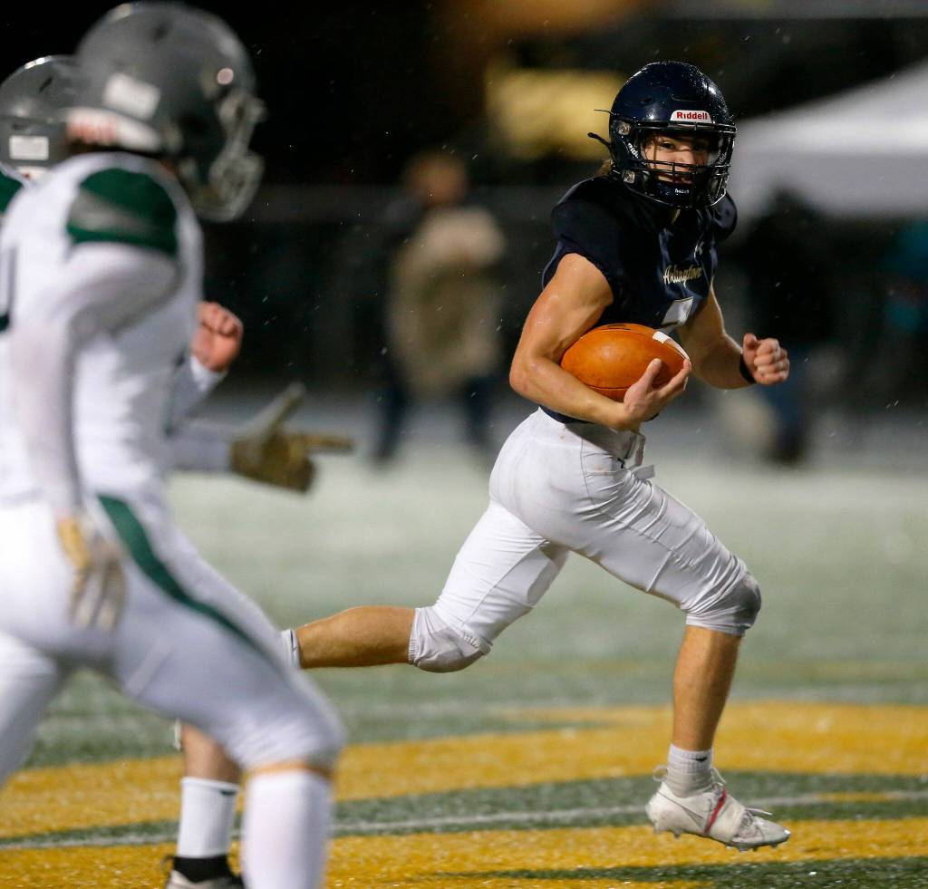 Arlingtons Chase Deberry returns a kick against Ridgeline during a playoff matchup Friday, Nov. 10, 2023, at Arlington High School in Arlington, Washington. (Ryan Berry / The Herald)