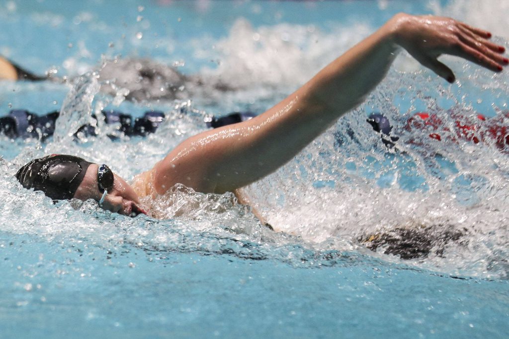 Snohomishs Mary Clarke swims and wins the 100-yard freestyle during the 3A girls state swim and dive championships at King County Aquatic Center in Federal Way, Washington on Saturday, Nov. 11, 2023. (Annie Barker / The Herald)