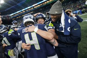 Seattle Seahawks place-kicker Jason Myers (5) celebrates with punter Michael Dickson (4) after he kicked the game-winning field goal against the Washington Commanders on Sunday in Seattle. (AP Photo/Lindsey Wasson)
