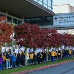 Providence nurses picket in front of the hospital during the first day of their planned five-day strike Tuesday, Nov. 14, 2023, at Providence Regional Medical Center in Everett, Washington. (Ryan Berry / The Herald)