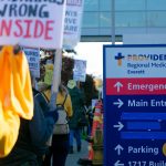 Providence nurses picket in front of the hospital during the first day of their planned five-day strike Tuesday, Nov. 14, 2023, at Providence Regional Medical Center in Everett, Washington. (Ryan Berry / The Herald)