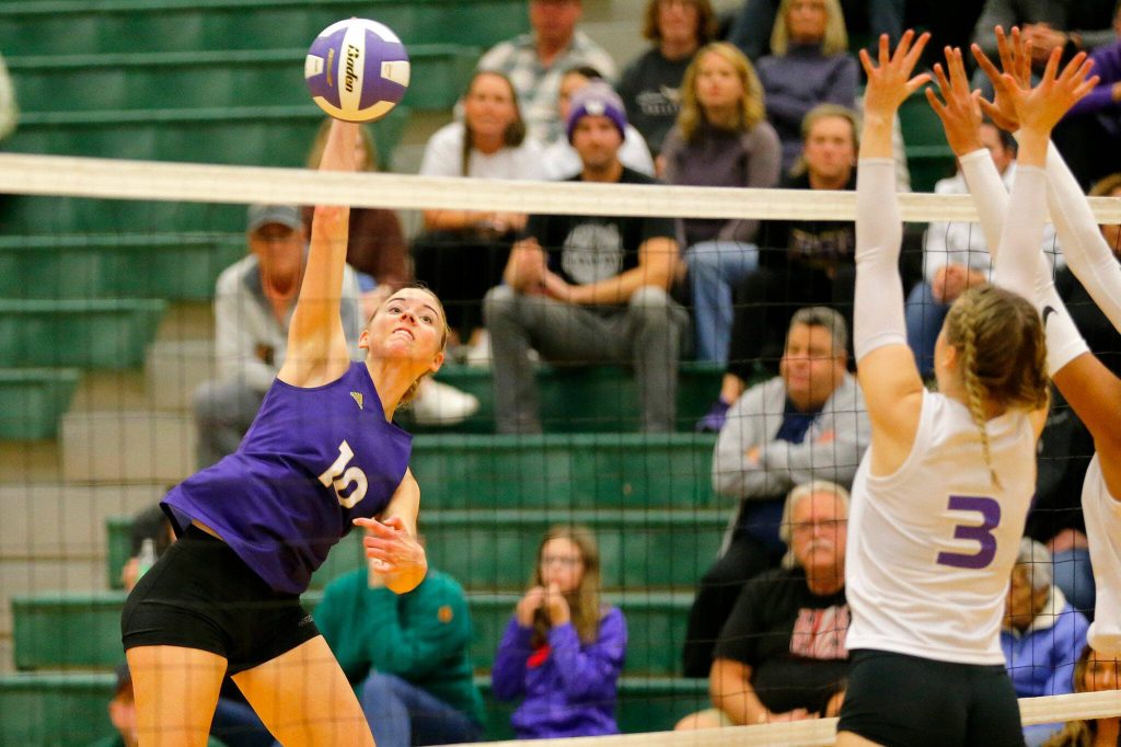 Lake Stevens hitter Jayci Scrivens spikes the ball over the net against North Creek during the Class 4A bi-district 1/2 championship match Nov. 11 at Jackson High School in Mill Creek. (Ryan Berry / The Herald)