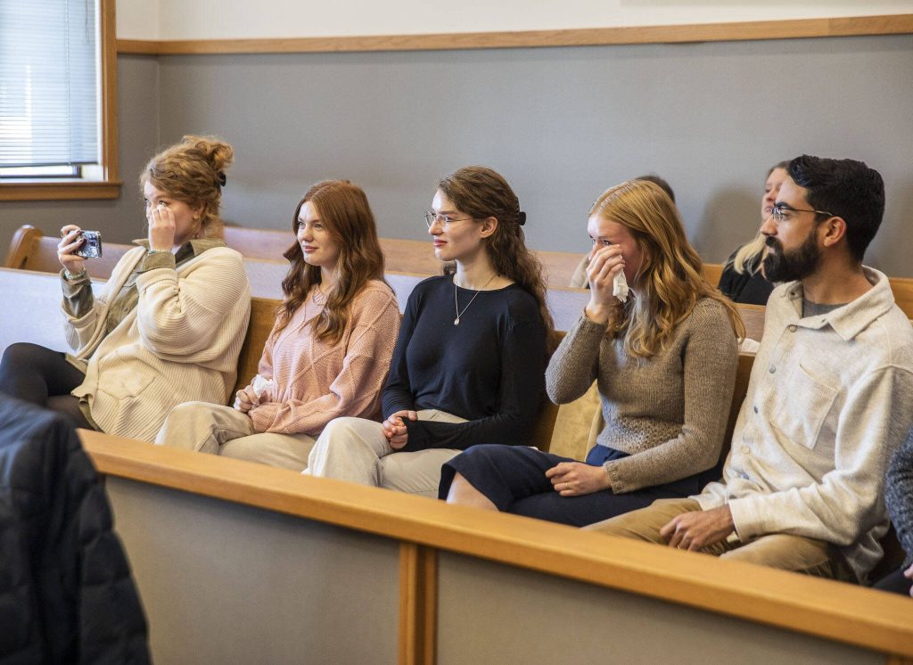 Family and friends of the Myers family tear up during their adoption on Friday, Nov. 17, 2023 in Everett, Washington. (Olivia Vanni / The Herald)