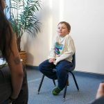 Thomas shrugs in response to a question during an interview with the Herald on Monday, Nov. 20, 2023, at Jackson Elementary School in Everett, Washington. (Ryan Berry / The Herald)