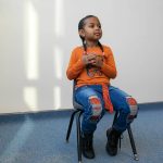 Ridayna listens to a question during an interview with the Herald on Monday, Nov. 20, 2023, at Jackson Elementary School in Everett, Washington. (Ryan Berry / The Herald)