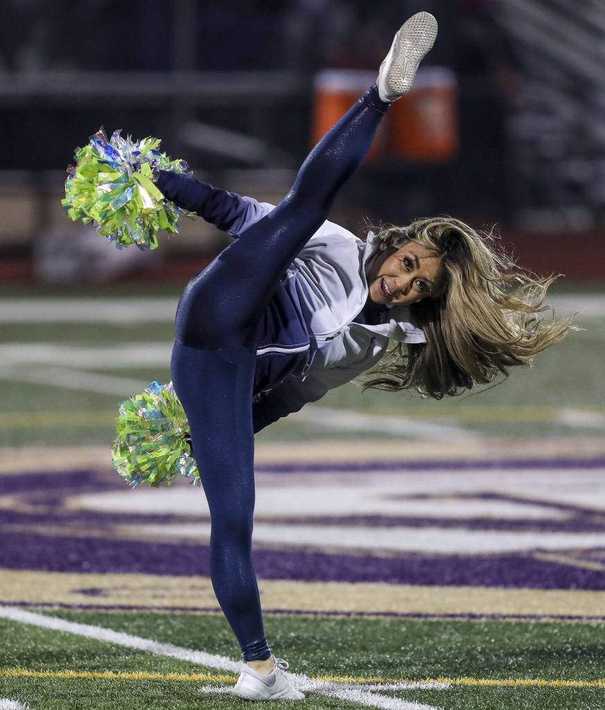 A Seahawks Dancer perfroms during a game between Lake Stevens and Kennedy Catholic at Lake Stevens High School in Lake Stevens, Washington on Friday, Nov. 17, 2023. Lake Stevens won, 44-21. (Annie Barker / The Herald)