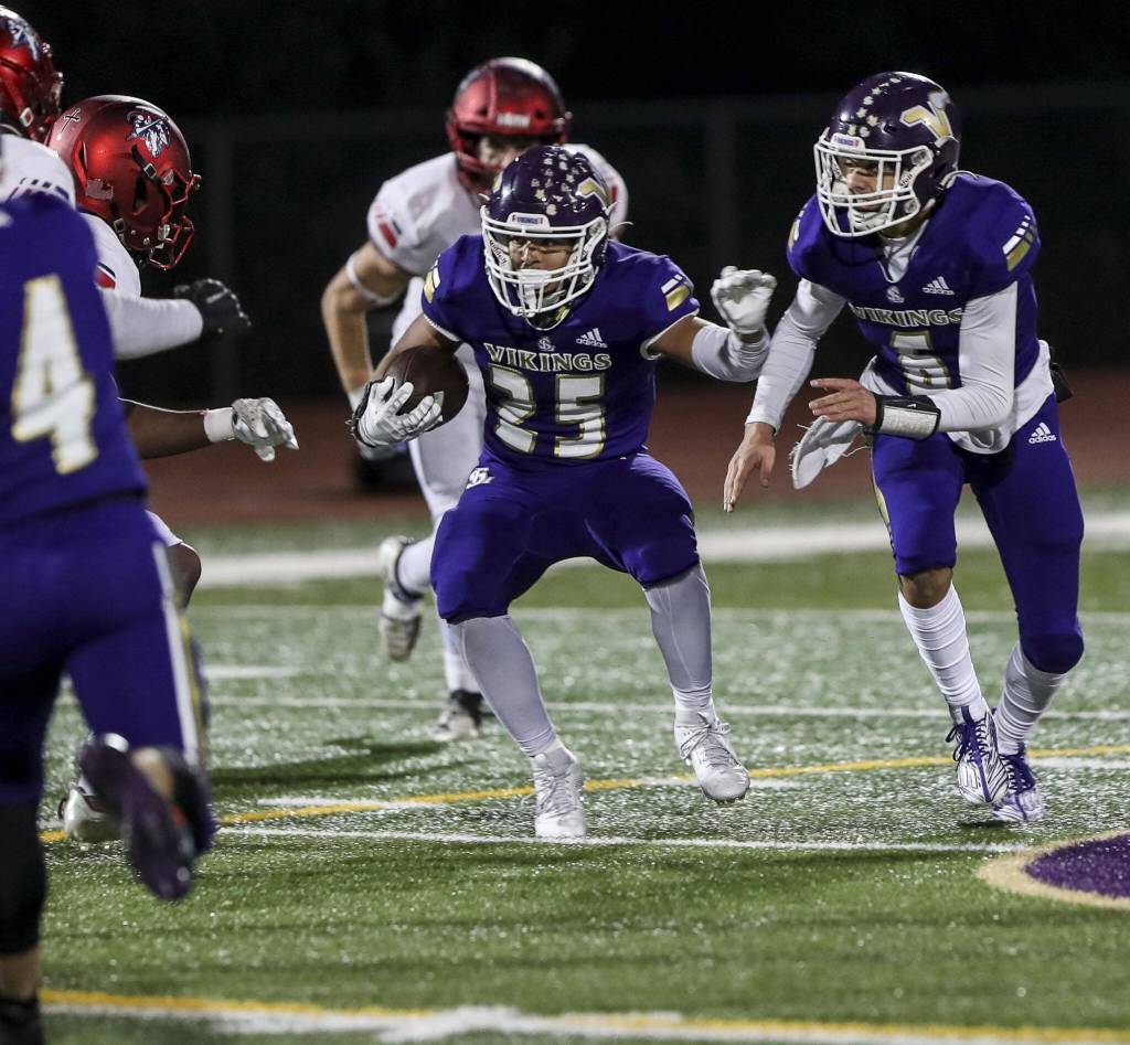 Lake Stevens Isaac Burks (25) moves with the ball during a game between Lake Stevens and Kennedy Catholic at Lake Stevens High School in Lake Stevens, Washington on Friday, Nov. 17, 2023. Lake Stevens won, 44-21. (Annie Barker / The Herald)