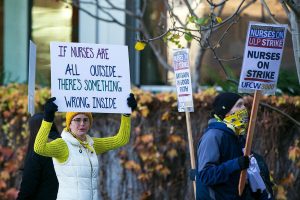 Providence nurses picket in front of the hospital during the first day of their planned 5-day strike Tuesday, Nov. 14, 2023, at Providence Regional Medical Center in Everett, Washington. (Ryan Berry / The Herald)