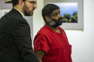 John Curran, right, stands during his sentencing for third-degree child rape at the Snohomish County Superior Court in Everett, Washington on Tuesday, Nov. 21, 2023. (Annie Barker / The Herald)
