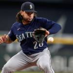 Seattle Mariners third baseman Eugenio Suarez fields a ground ball by Texas Rangers' Josh Jung in the first inning of a baseball game, Sunday, Sept. 24, 2023, in Arlington, Texas. Jung was thrown out at first base on the play. (AP Photo/Tony Gutierrez)