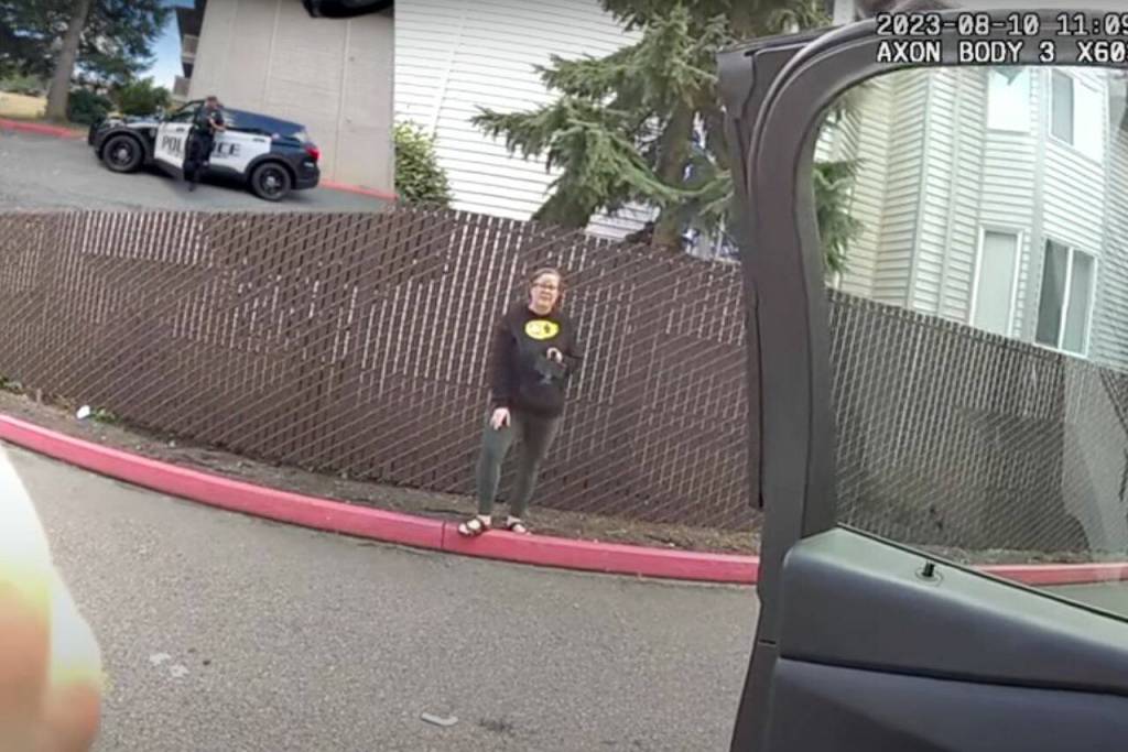 From the bodycam footage of Everett police officer Ryan Greely and footage from Molly Wright, Wright films officer Greely before he arrests her for obstructing a law enforcement officer on Aug. 10, 2023 in Everett, Washington. (Screenshot from a video provided by Molly Wright)