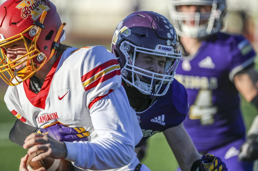 Players fight for the ball during a Class 4A state semifinal game between Lake Stevens and Kamiakin at Lake Stevens High School in Lake Stevens, Washington on Saturday, Nov. 25, 2023. Lake Stevens won, 48-7. (Annie Barker / The Herald)