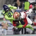 San Francisco 49ers wide receiver Brandon Aiyuk catches a pass for a touchdown against Seattle Seahawks defensive back Devon Witherspoon (21) during a game Nov. 23 in Seattle. (AP Photo/Ben VanHouten)