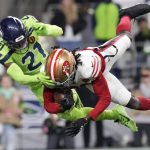 San Francisco 49ers wide receiver Brandon Aiyuk (11) catches a pass for a touchdown during an NFL football game against the Seattle Seahawks, Thursday, Nov. 23, 2023 in Seattle. The 49ers won 31-13. (AP Photo/Ben VanHouten)