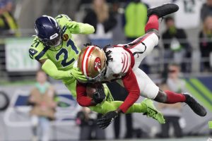 San Francisco 49ers wide receiver Brandon Aiyuk (11) catches a pass for a touchdown during an NFL football game against the Seattle Seahawks, Thursday, Nov. 23, 2023 in Seattle. The 49ers won 31-13. (AP Photo/Ben VanHouten)