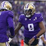 Washington quarterback Michael Penix Jr. (9) celebrates throwing a touchdown to wide receiver Rome Odunze (1) against Washington State during the first half of an NCAA college football game, Saturday, Nov. 25, 2023, in Seattle. (AP Photo/Lindsey Wasson)